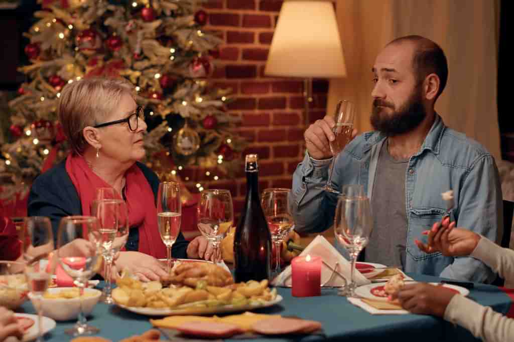 A family sat around the Christmas dinner table - Which rehab